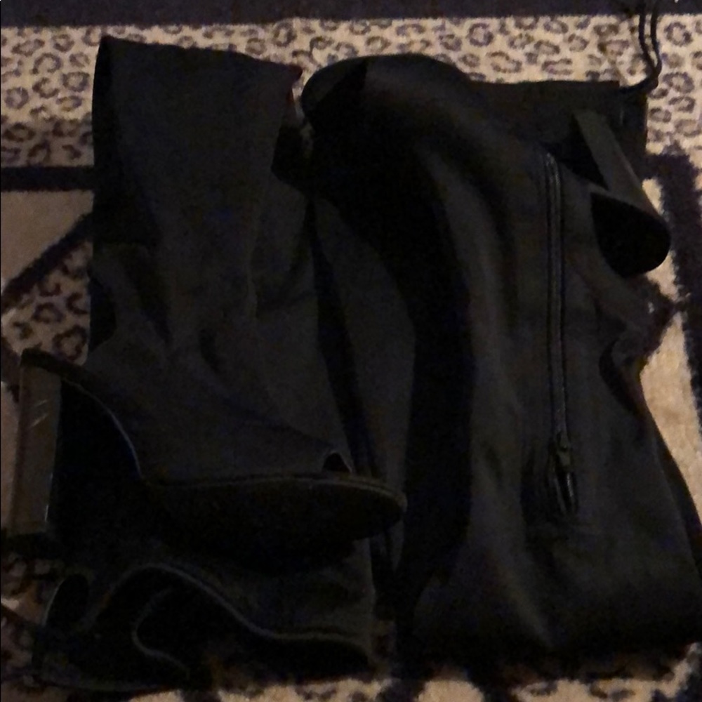 Thigh high heeled booties